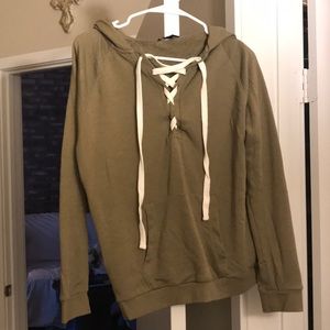 A sweater with white tie in front